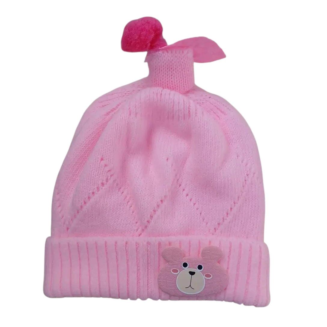 Pink knitted winter cap with teddy bear face and decorative pink topper