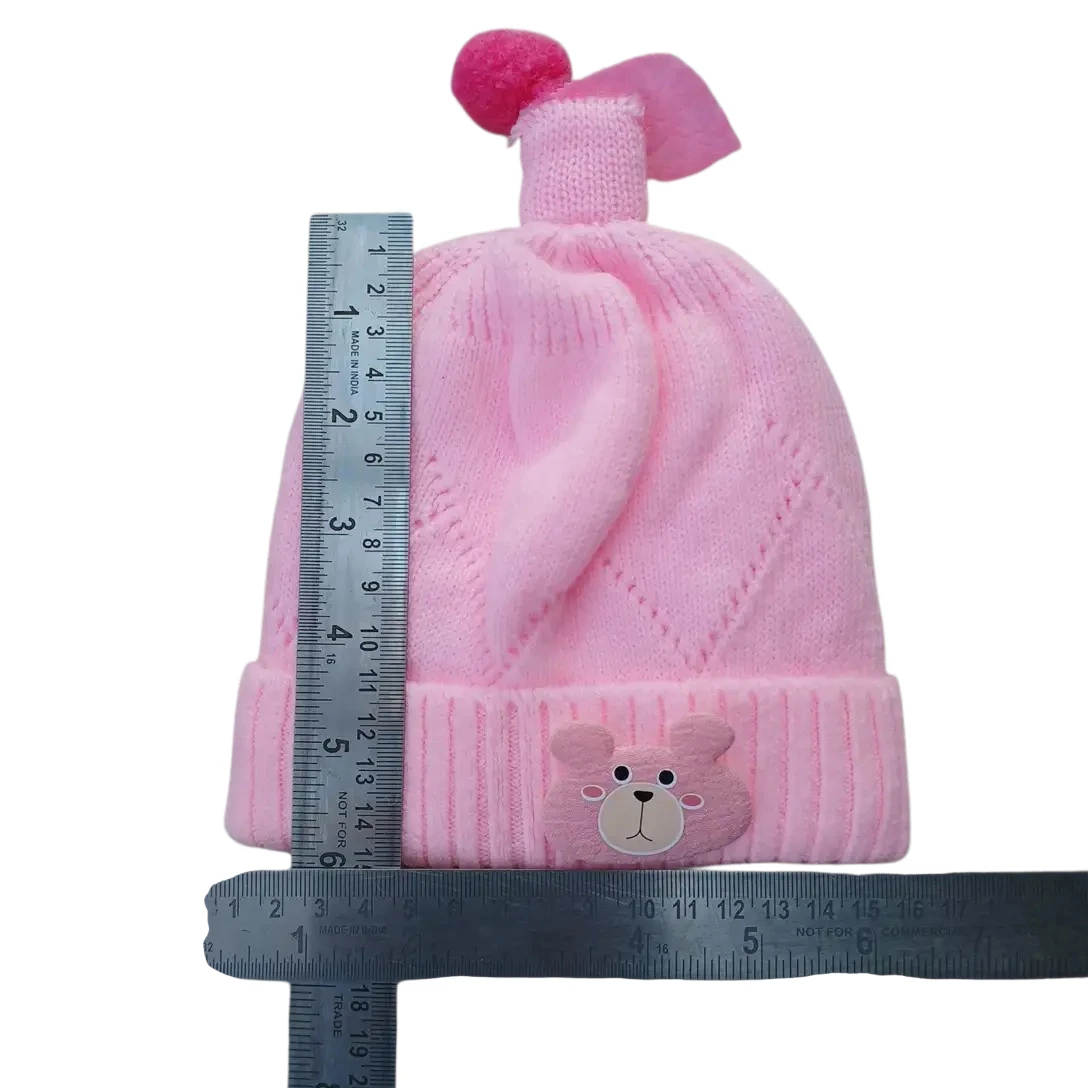 Pink knitted winter cap with teddy bear face and decorative pink topper size
