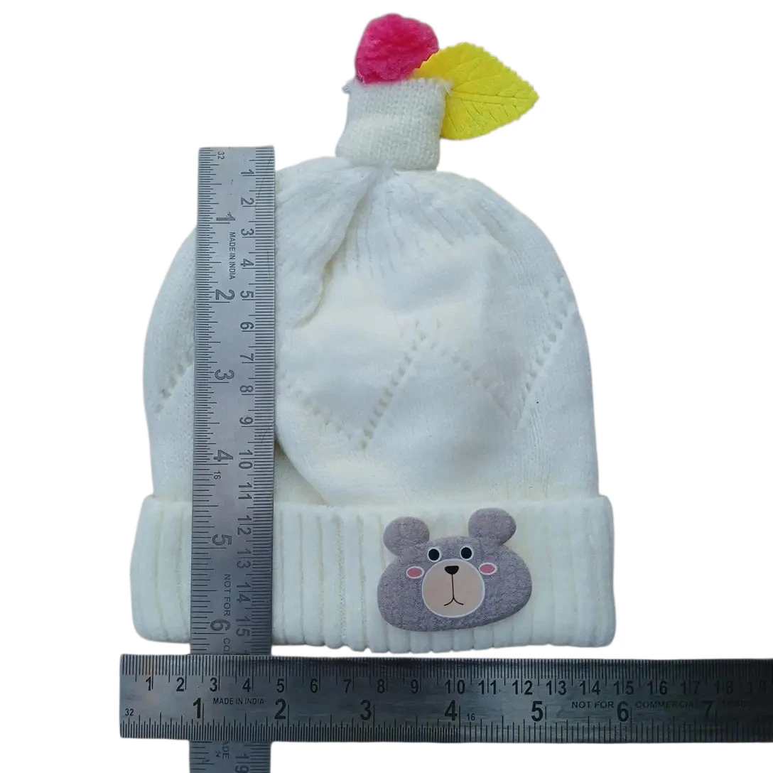 White baby winter cap with bear-face patch and pink-yellow decorative topper size