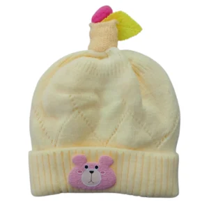 Cream baby winter cap with pink bear patch and decorative topper