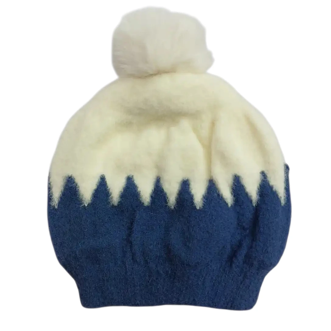 Navy blue and cream baby winter cap with fluffy cream pom-pom and zigzag pattern
