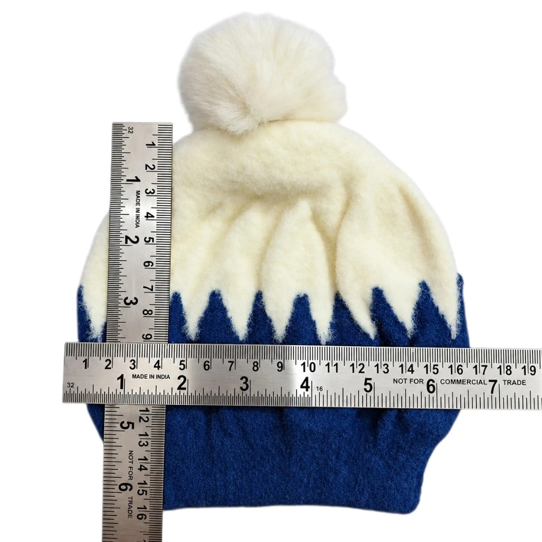 Navy blue and cream baby winter cap with fluffy cream pom-pom and zigzag pattern size